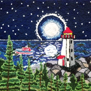 # 5 - Coming Home, hooked by Aileen Cassells of Toronto, ON. An adaptation of a design by Christine Little (Lighthouse at Sunset). Aileen's uncle was a ship's pilot who lived in Port Hawkesbury, NS. She hooked this rug for her mother in his memory. He was a much beloved brother. The mat is 29.5" x 22" and was completed in 2021. Photographed by Aileen.