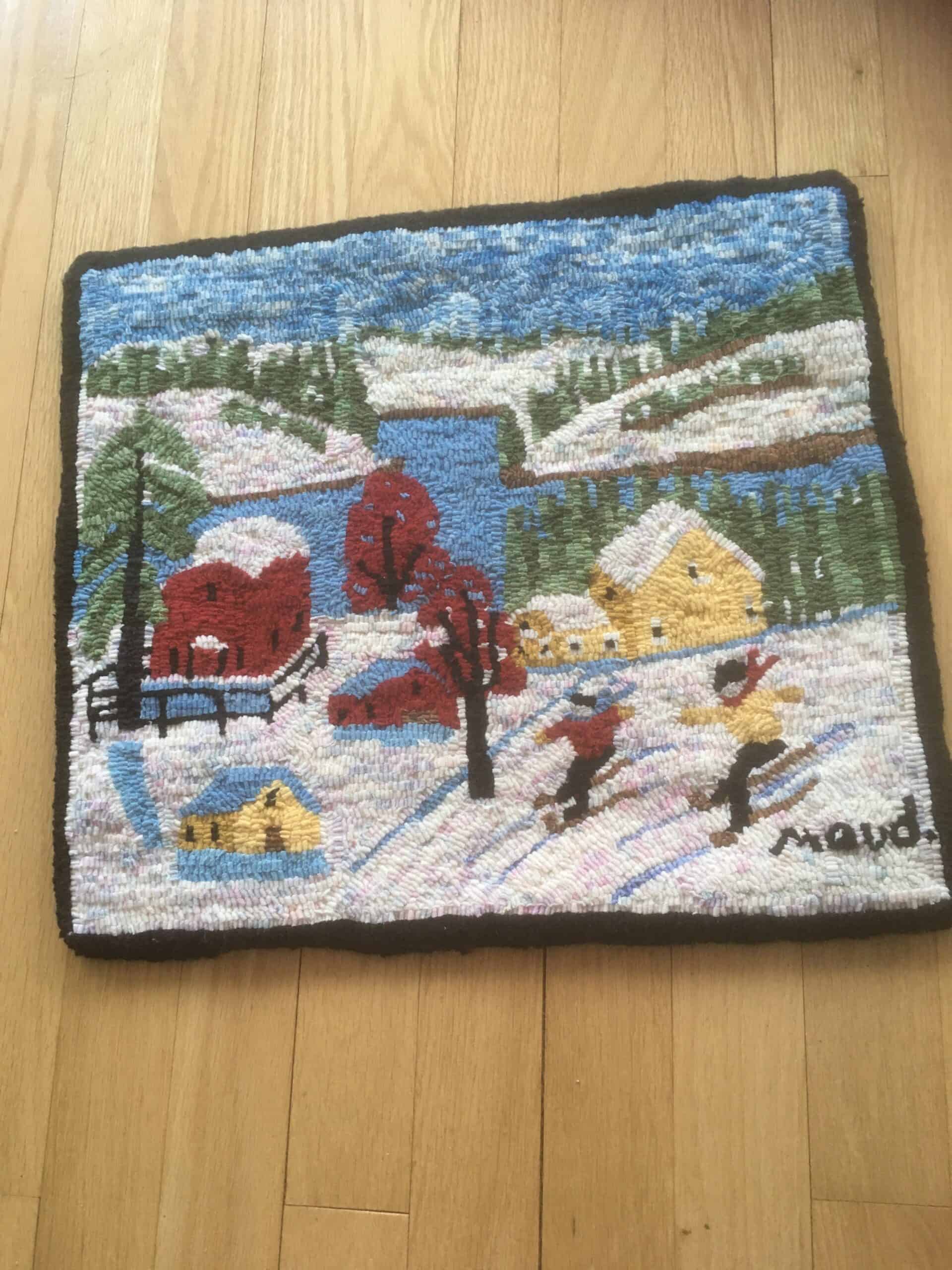 A Maud Lewis pattern by Highland Heart Hookery, hooked and photographed by <strong>Cathy Smith</strong>, Chamcook NB, completed in 2021, 16" x 18"