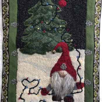 Nigel Gets Ready for Christmas, an original design, hooked and photographed by Ellen Tancock, New Ross NS. Mat is 18" x 36" and was made from a wool coat and Ellen's dyed wool. Completed in 2022