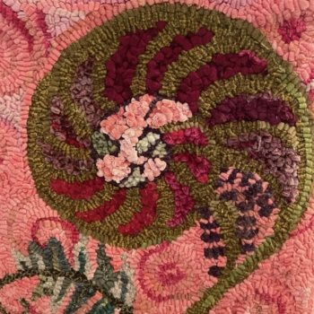 Fiddlehead Fern, cesigned by Brigitta Phy, hooked & photographed by Karyn Meyreles, Rancho Murieta, California USA. Mat is 14.75" square and was completed in 2019. Hooked with velvet and wool and finished with a crochet edge using variegated wool yarn.