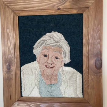 Portrait of My Mom, hooked and photographed by Edie Hagarty, Perth, ON. An adaptation from a photo, for a class with Wendie Scott Davis - Portraits Made Simple. Mat is 10.5" x 13.5" and was completed in 2019.